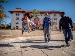 Student jumping in the air